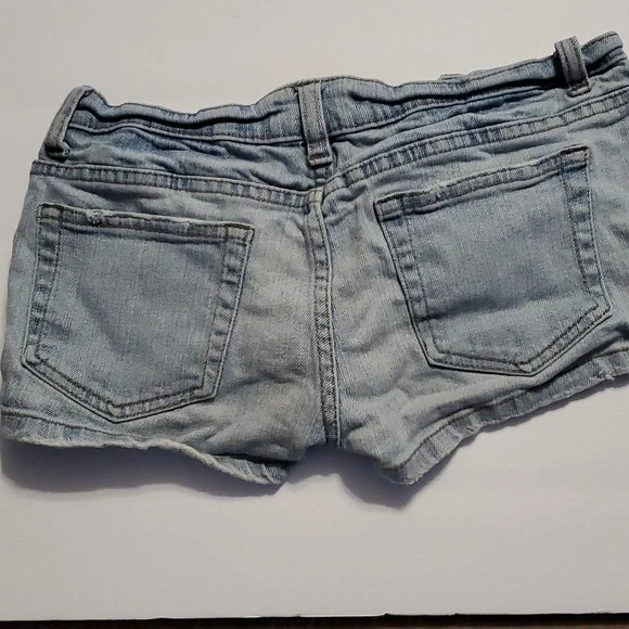 Denimco button up jean shorts with some distressed look on the legs and pockets - Picture 3 of 3